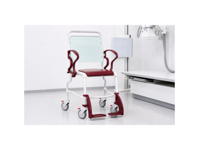 Chair with radiolucent backrest and foam seat two armrests and retractable footrests