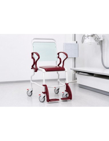 Chair with radiolucent backrest and foam seat two armrests and retractable footrests