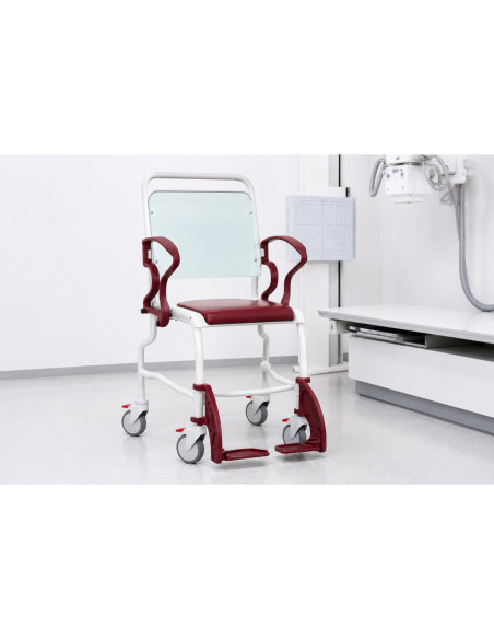 Chair with radiolucent backrest and foam seat two armrests and retractable footrests